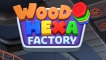 A neat wooden grid filled with colorful hexagonal block stacks in a factory setting