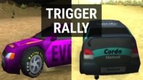 A rally car drifting sideways around a muddy bend in Trigger Rally